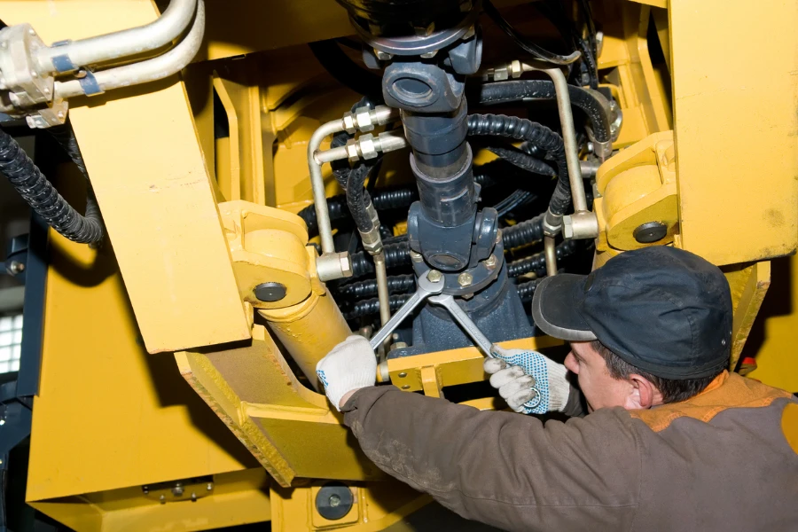 Man repairing heavy duty machine