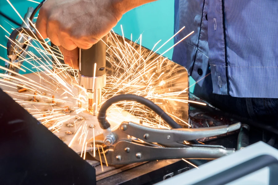 Man using a spot welding machine