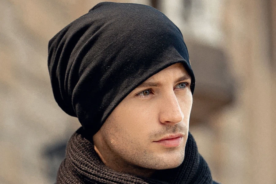 Man wearing a black slouchy beanie