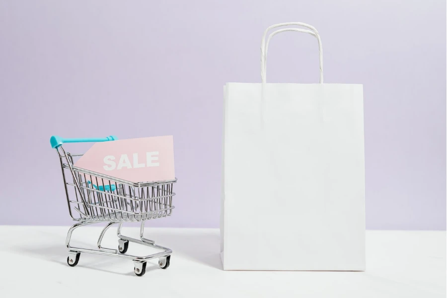 sale sign in a mini shopping cart