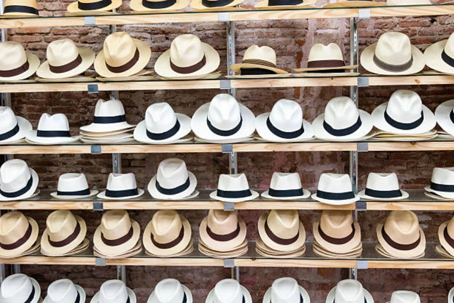 Shelves of white and straw Panama hats