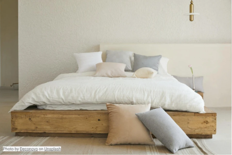 Simple wooden bedframe in a minimalist bedroom