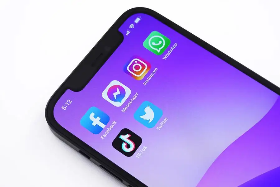 Social media apps on mobile with a purple background