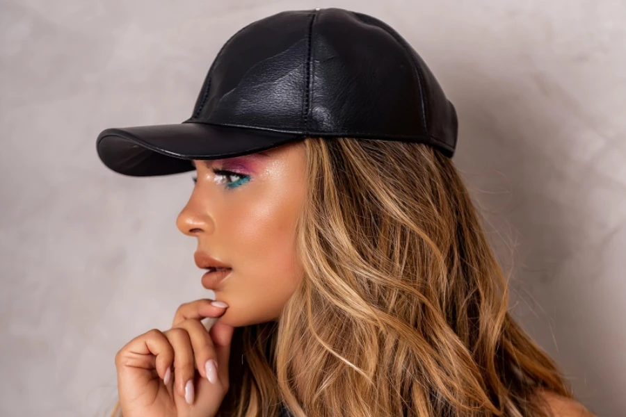 Woman in a dressier black leather ball cap