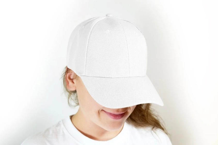 Woman wearing white curved bill ball cap