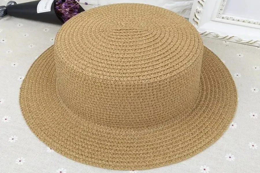 A close shot of a brown straw boater hat