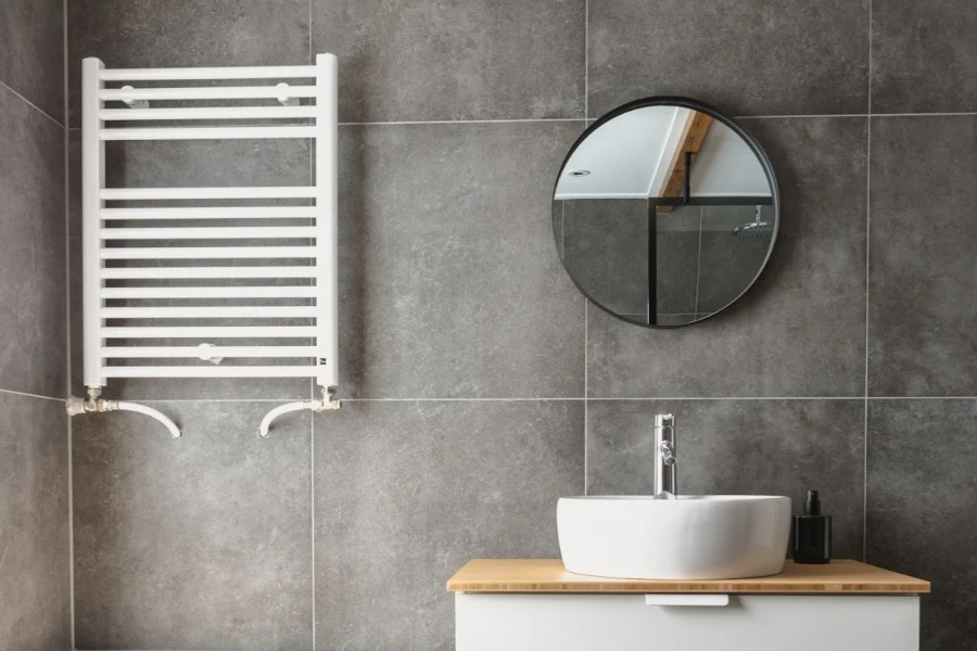 A hydronic wall-mounted towel warmer