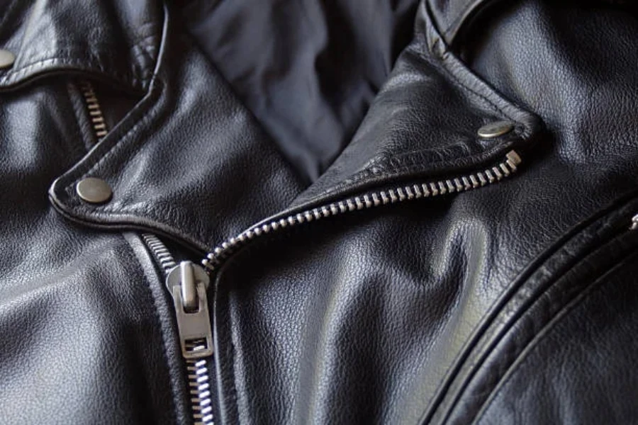 A zipper on a black motorcycle jacket