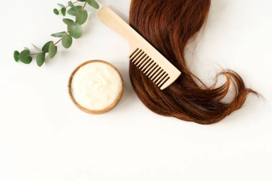 Auburn air on a table with a comb and hair cream