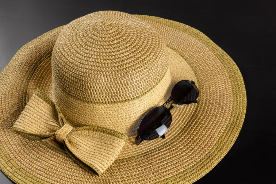 Floppy beach straw hat and sunglasses