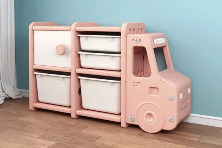 Large pink plastic truck used as a kids storage cabinet