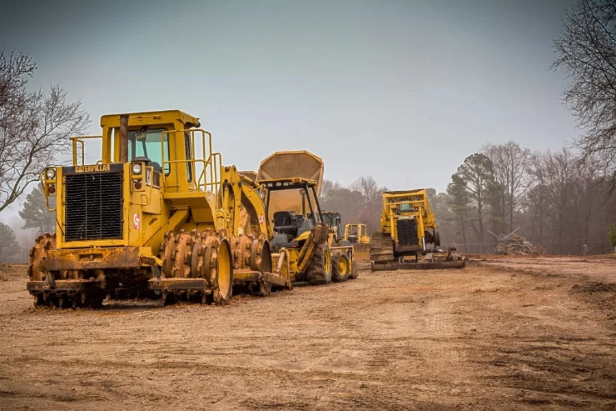 loader dan backhoe di tempat kerja