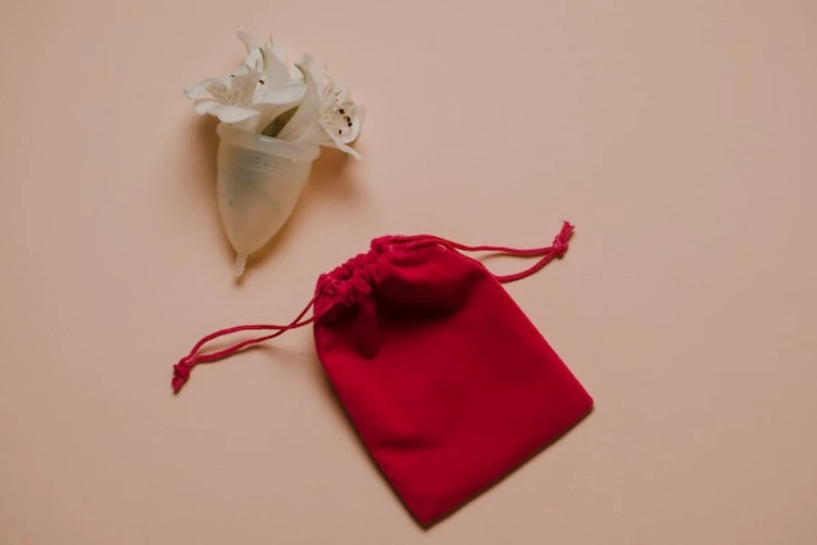 Menstrual cup with gentle white flowers