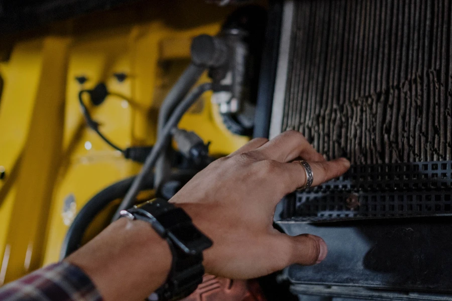 person checking a dirty engine filter