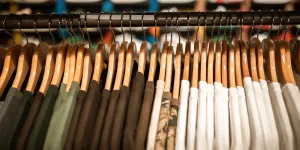 Photograph of shirts hanging on clothes hangers