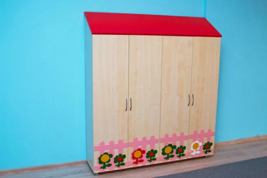 Tall wooden wardrobe with flowers painted along bottom