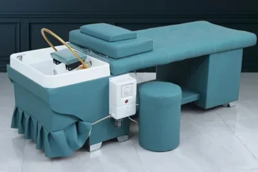 Teal shampoo bed with hydrotherapy features built in