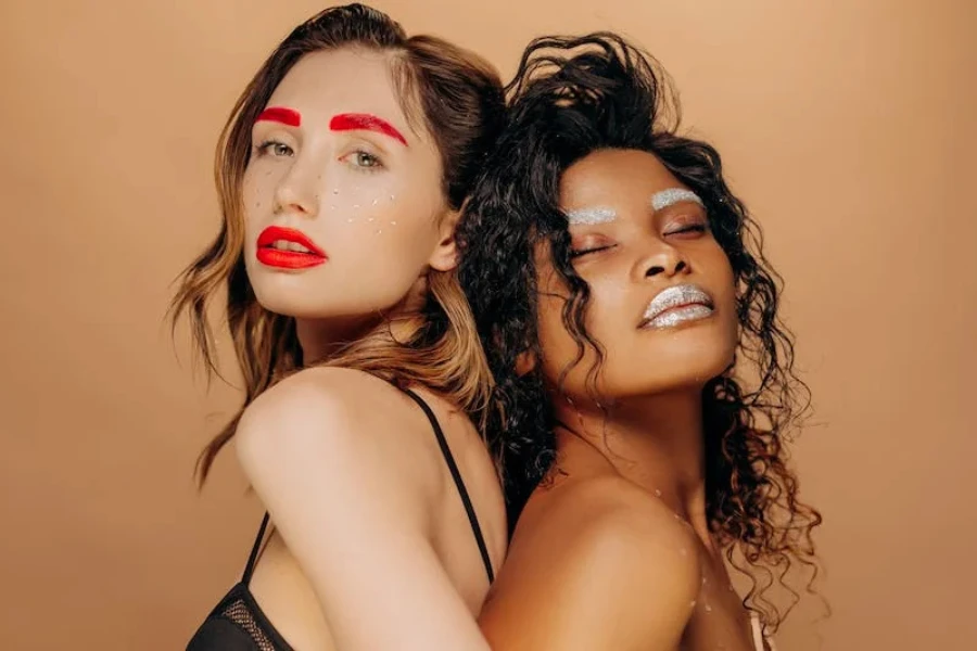 Two women with tinted colors over their original eyebrows