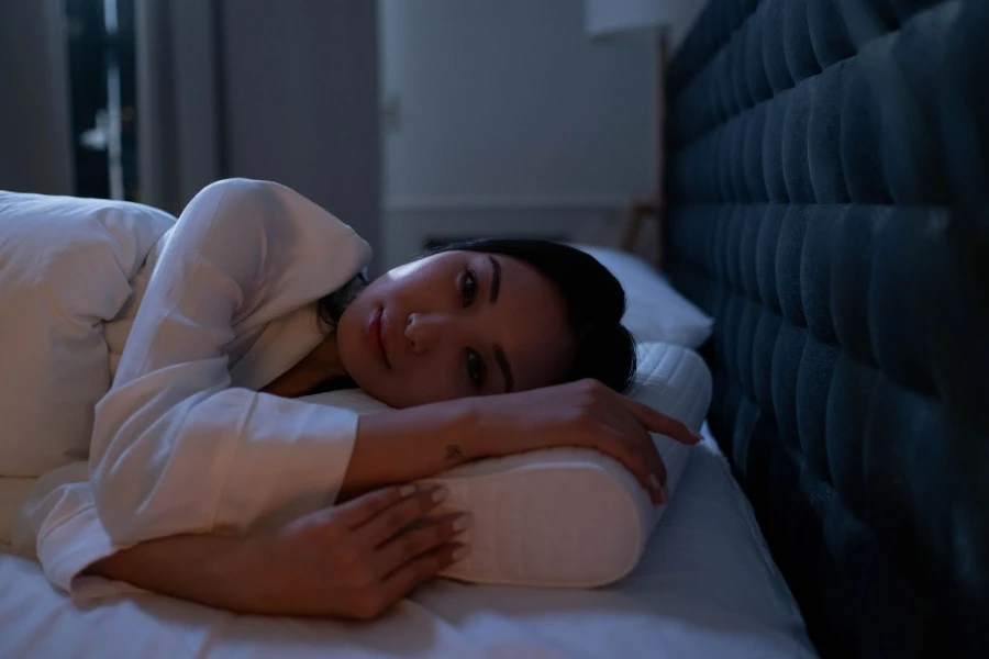 woman laying on memory foam pillow
