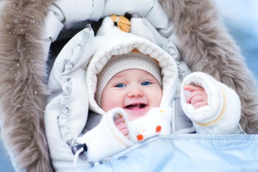 A baby in a winter baby sleeping bag