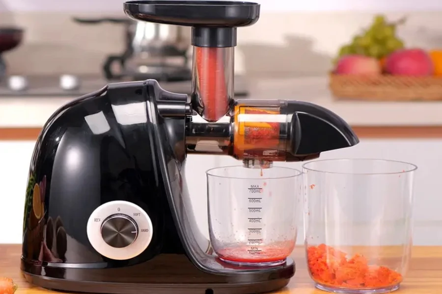 A cold-press slow juicer on a table