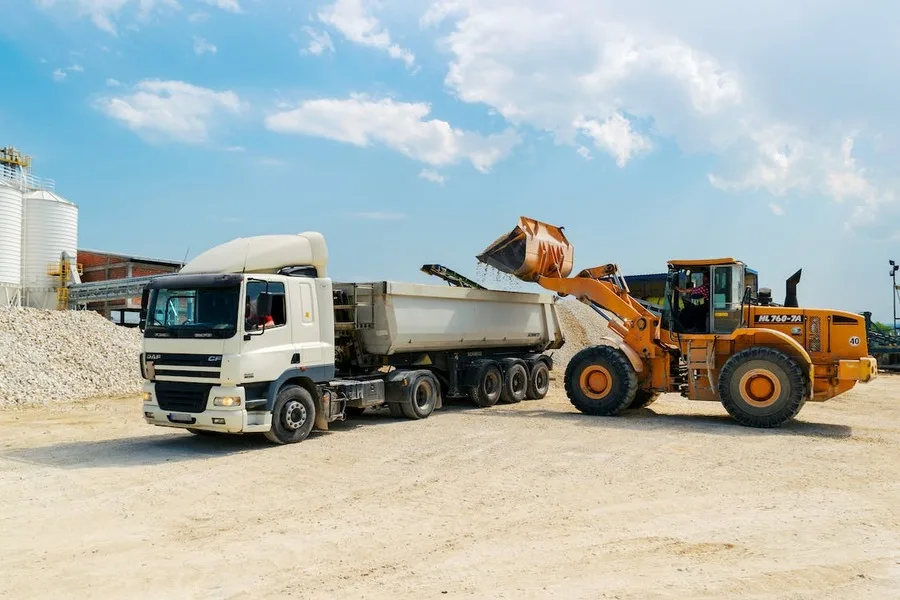 A loader loading materials to a truck