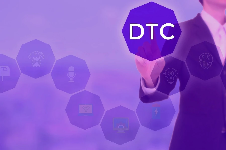 A man in a suit is holding touching a graphic that reads DTC against a purple tinted screen