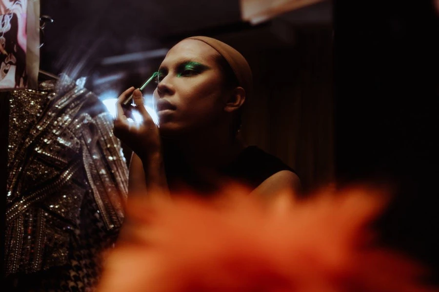 A woman applying an ethereal glow makeup