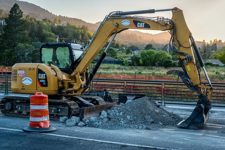 An excavator at a road construction site