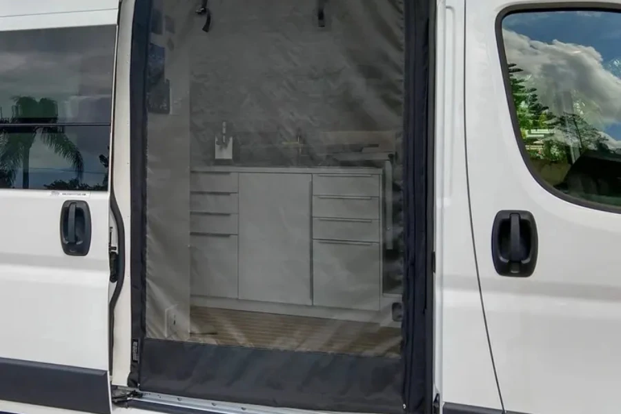 Bug net camper van accessory attached to open sliding door