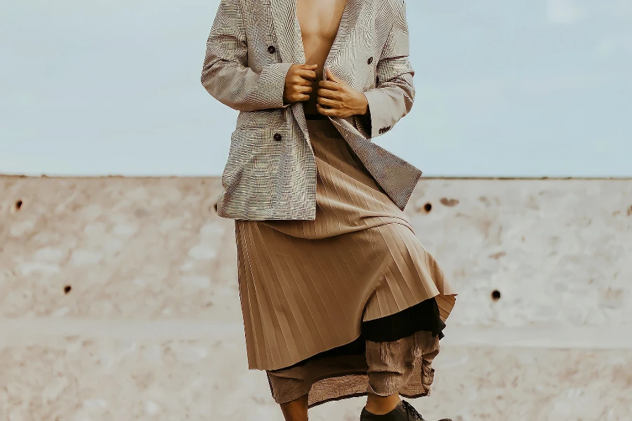 Man posing confidently in a long skirt
