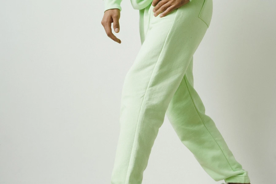 Man wearing light green sweatpants