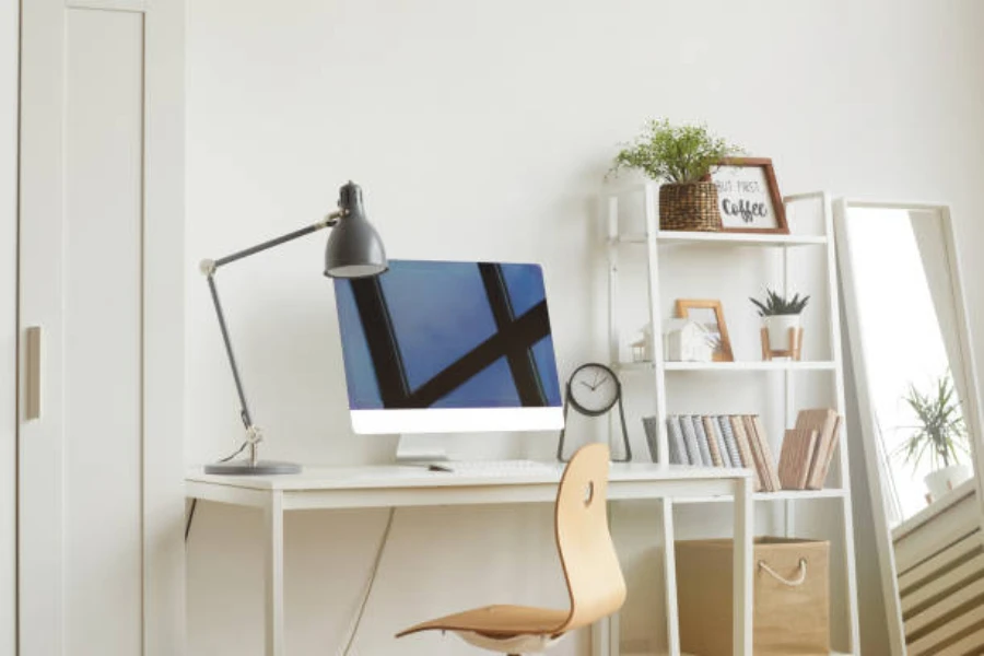 Modern white desk and chair with metal desk lamp