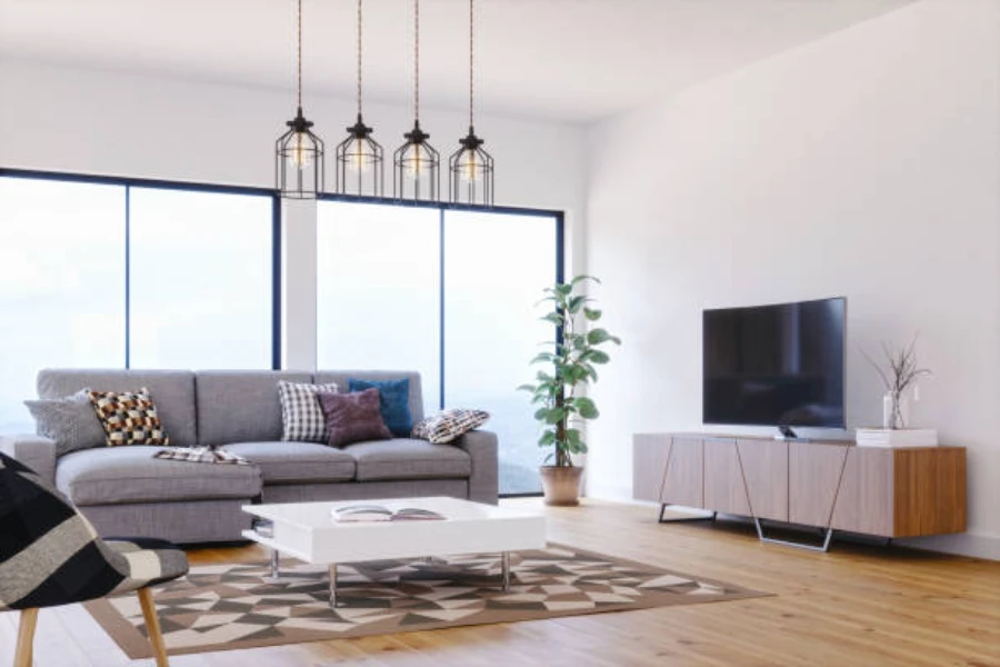 Sala de estar em espaço aberto com quatro luminárias de teto lustre modernas