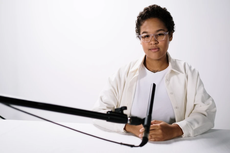 Person sitting in front of a microphone