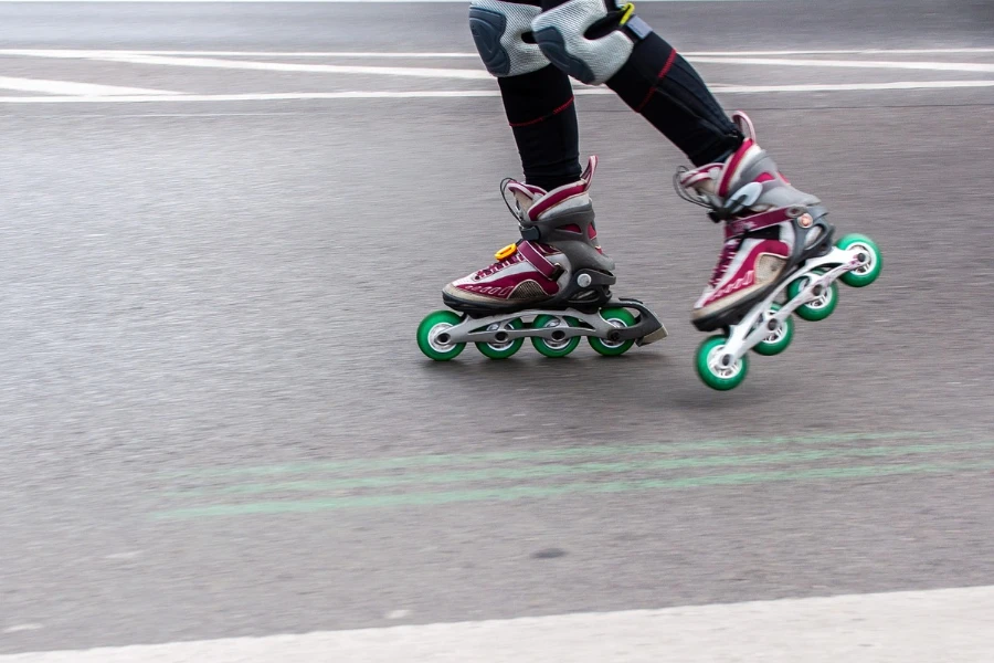Person skating on the pavement in inline skates