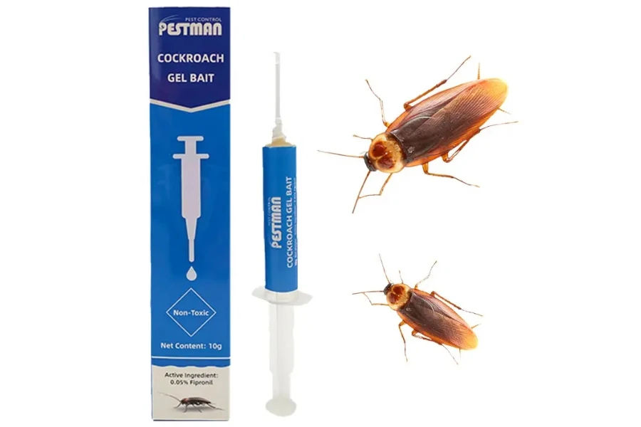 Pest bait next to box and two cockroaches