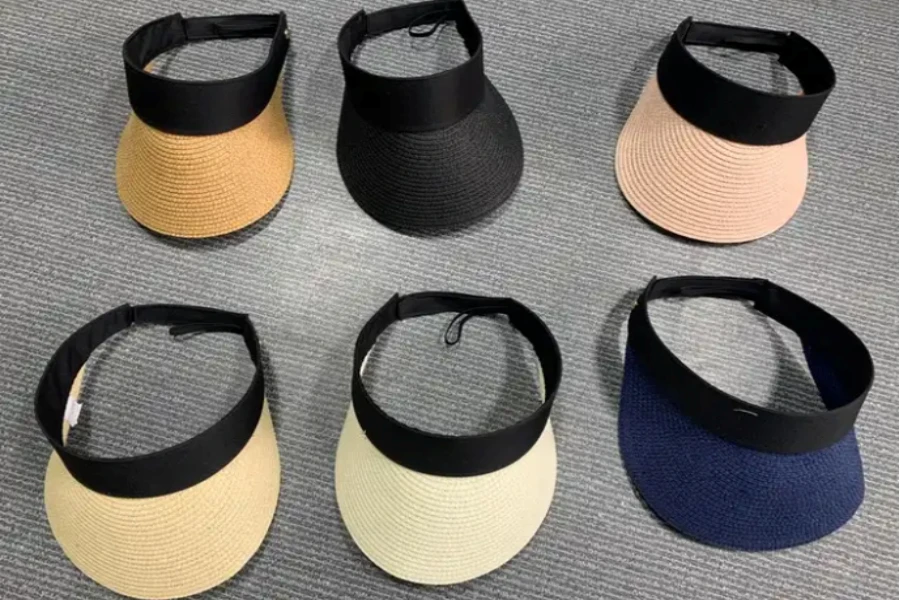 Two rows of wide brim visors in multiple colors