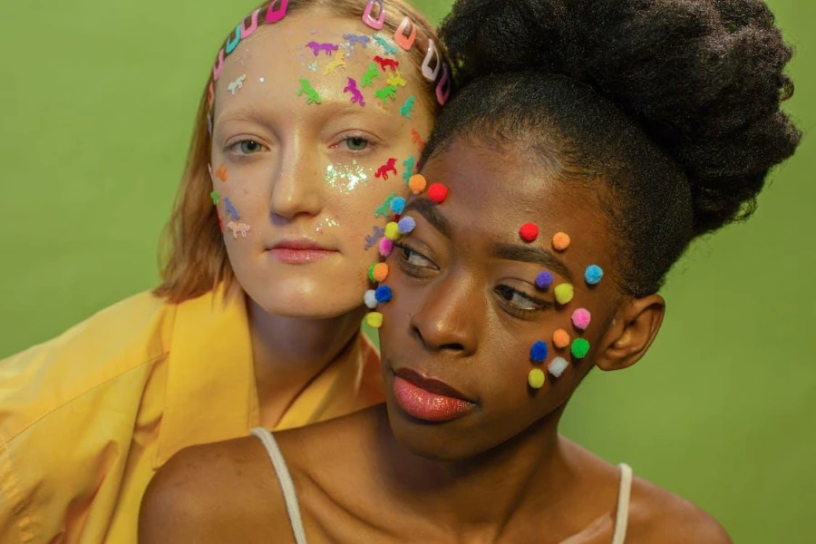 Two women in colorful expressions makeup