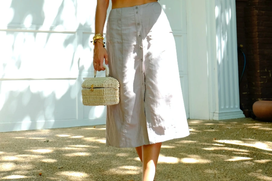 Woman wearing beige cargo midi skirt