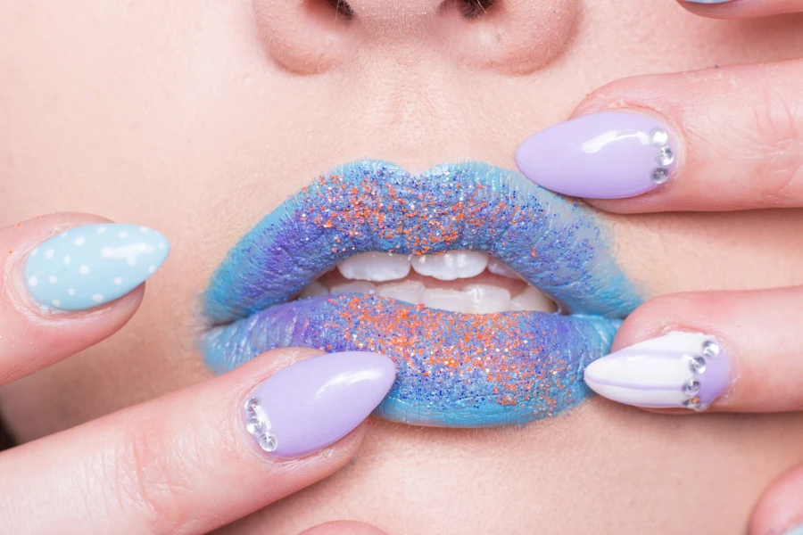 Woman with blue lipstick and nails done