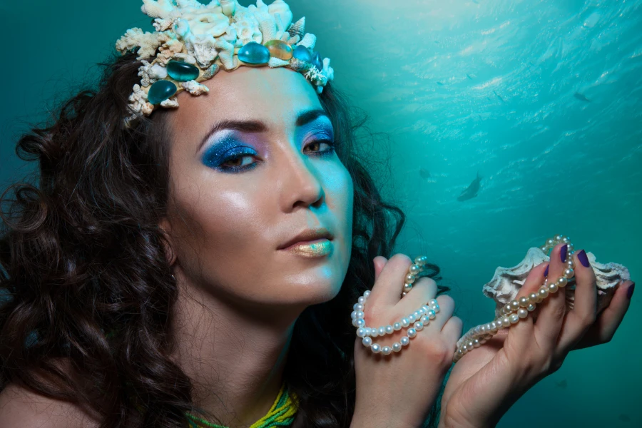 Woman with underwater world facial makeup