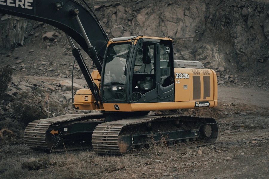 Yellow backhoe with gear-driven track