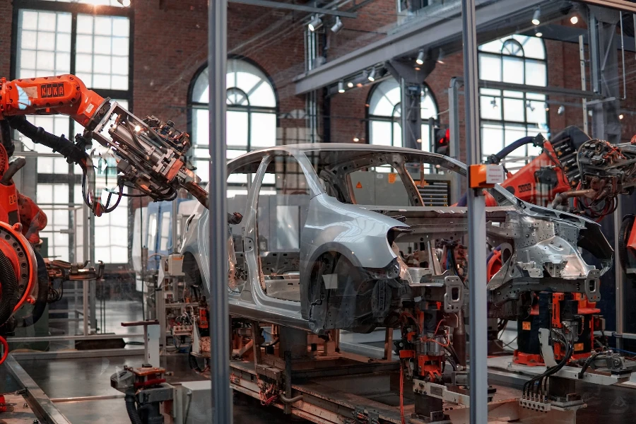 A robot machines fixing a gray car