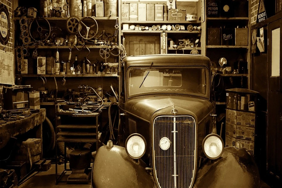 A vintage car parked in a garage