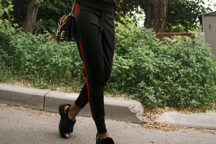 Black joggers with red and green track stripes