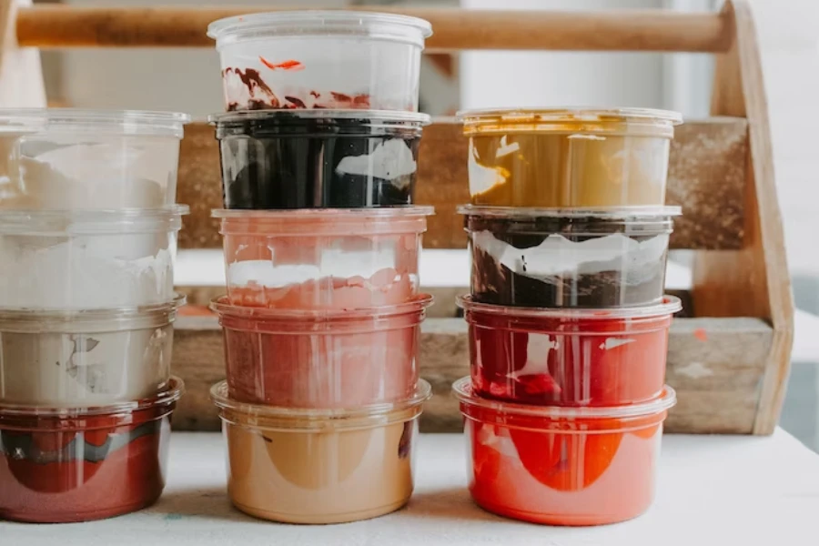 Different food containers on a white table