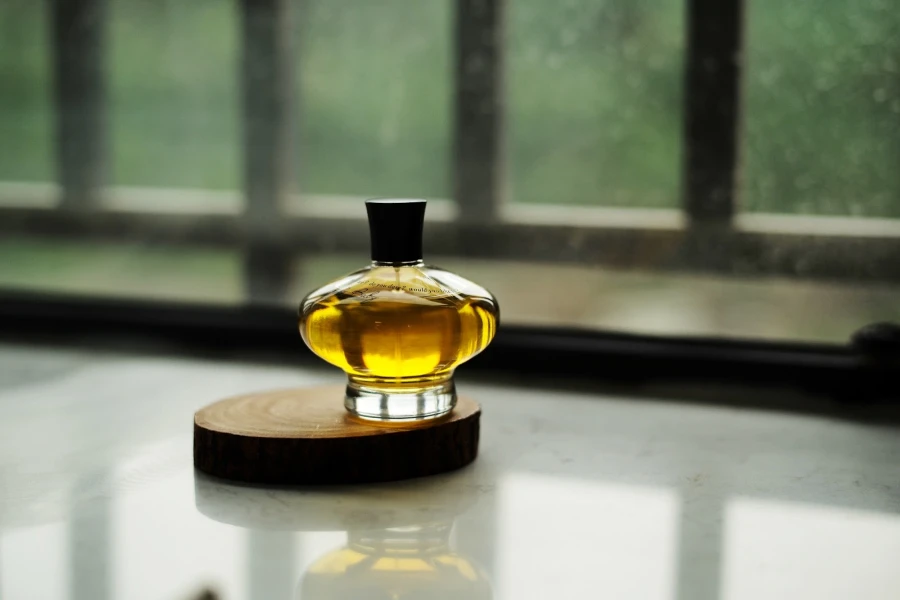 Fine fragrance glass bottle on brown coaster