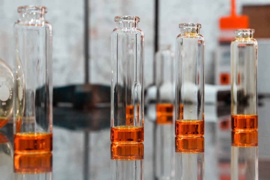 Glass bottles filled with orange liquid