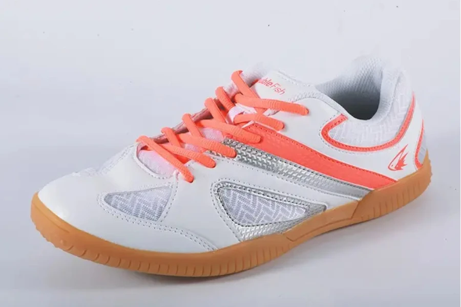 Left foot table tennis shoe in white and bright orange